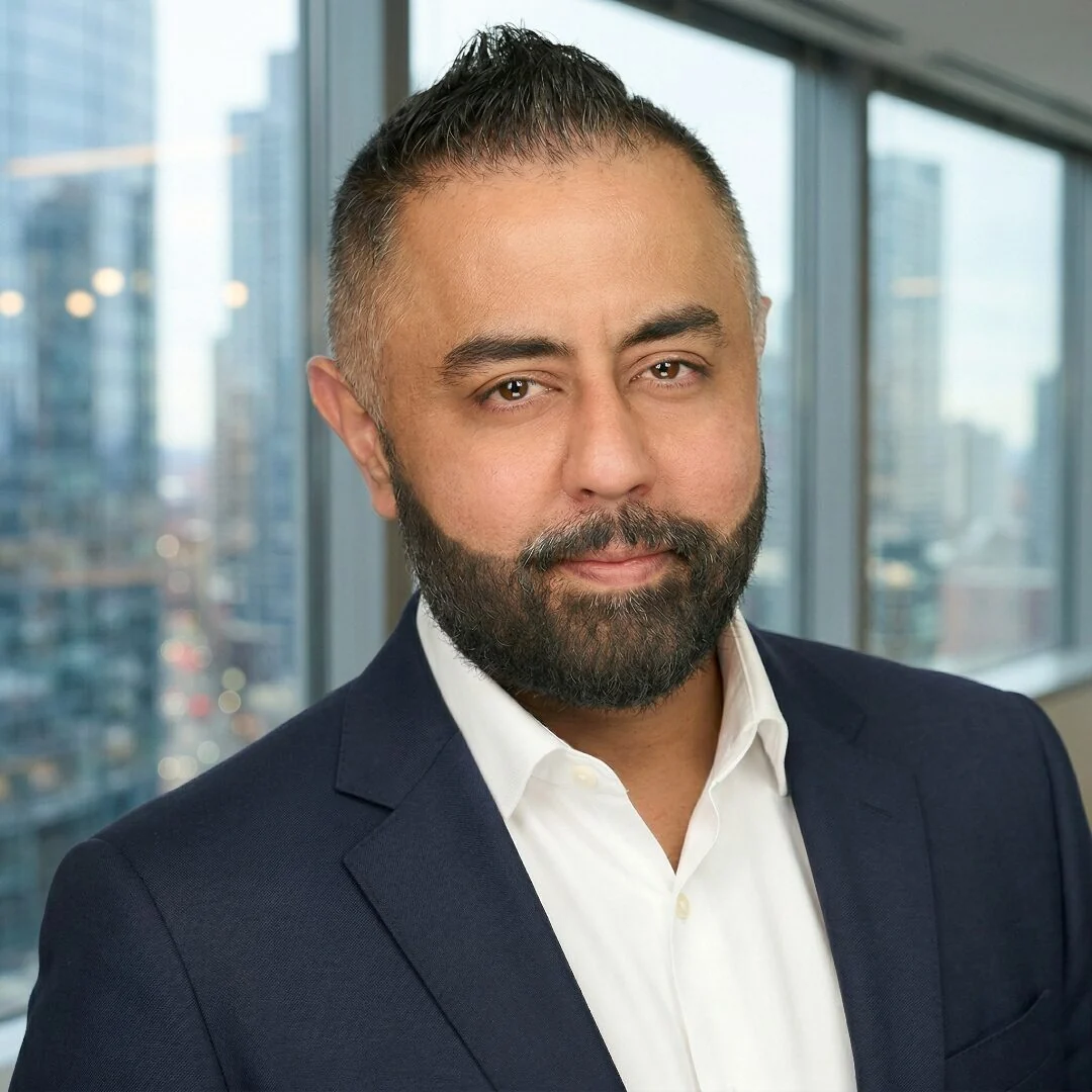 Omer Qureshi with city skyline behind